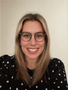 Adelyn Wooden young women with blonde hair and glasses with a polka dot shirt